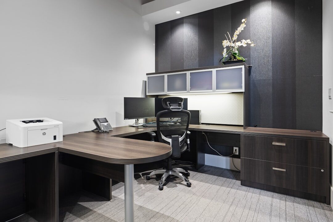 Bright modern newsroom office interior with desks and large windows